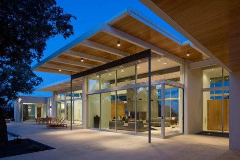 Glass walls, wooden ceilings and large overhang