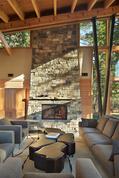 floor to ceiling glass and stone fireplace