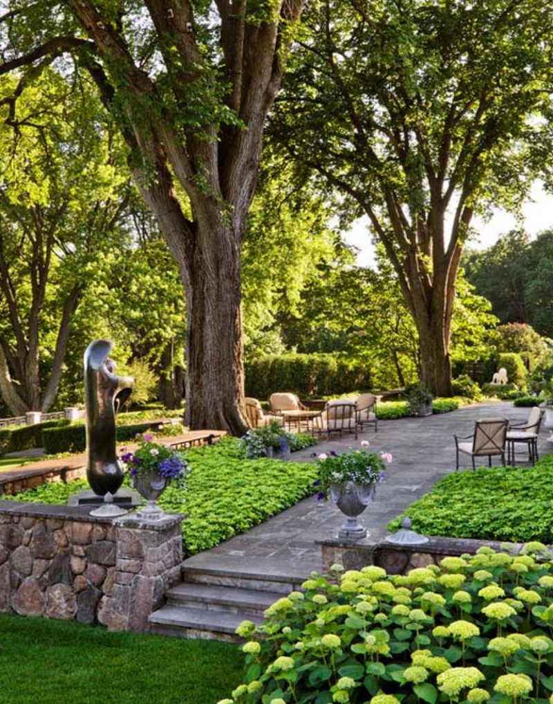 garden space with trees and sculpture