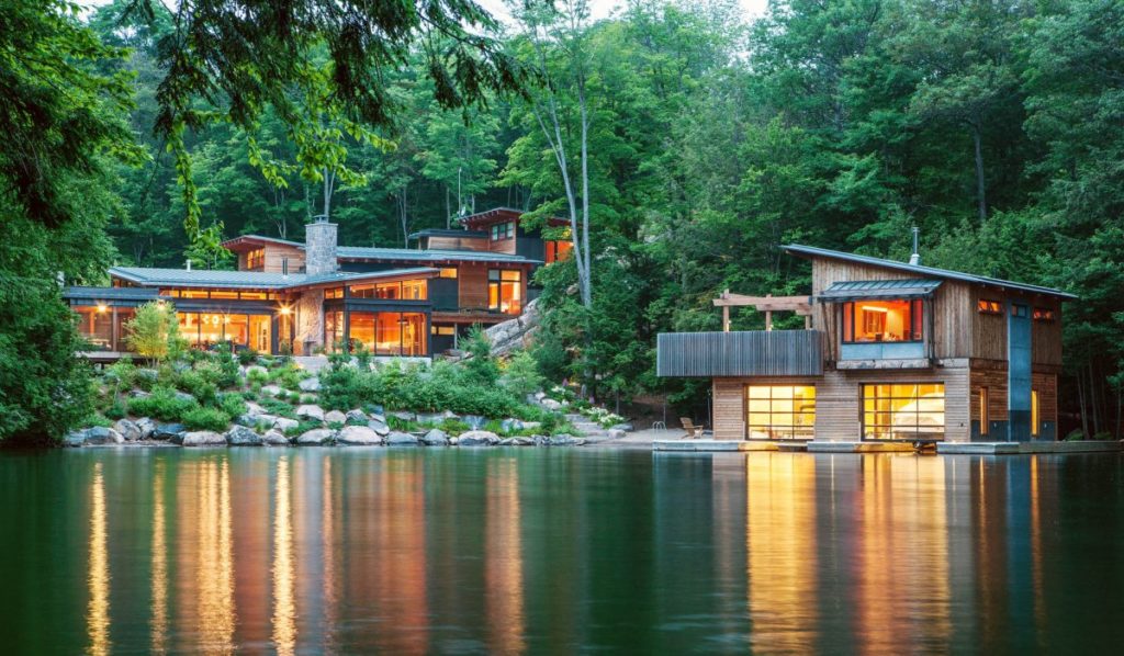 house on the lake with boathouse