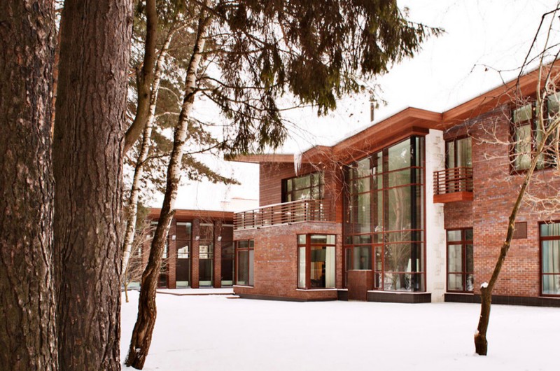 modern brick home in the woods