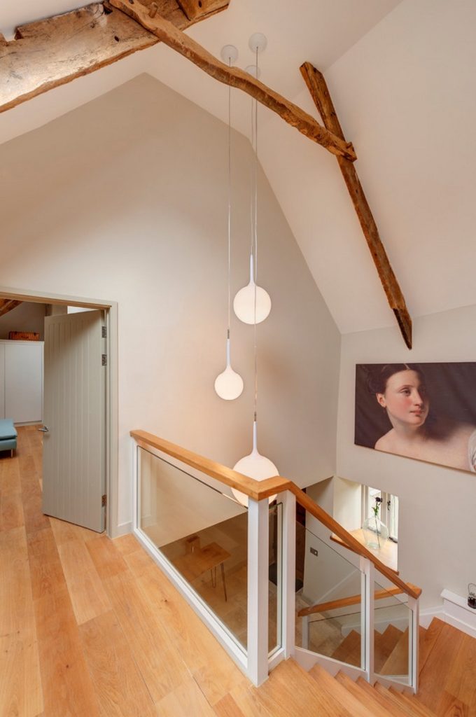 natural wood beams with pendant lights on staircase