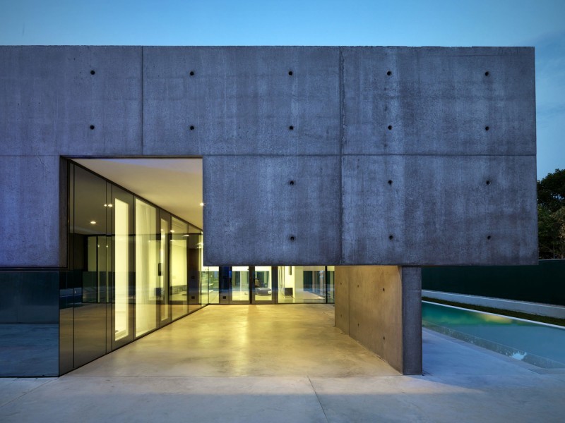 concrete home with pool