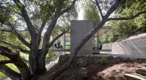 glass and concrete house on slope