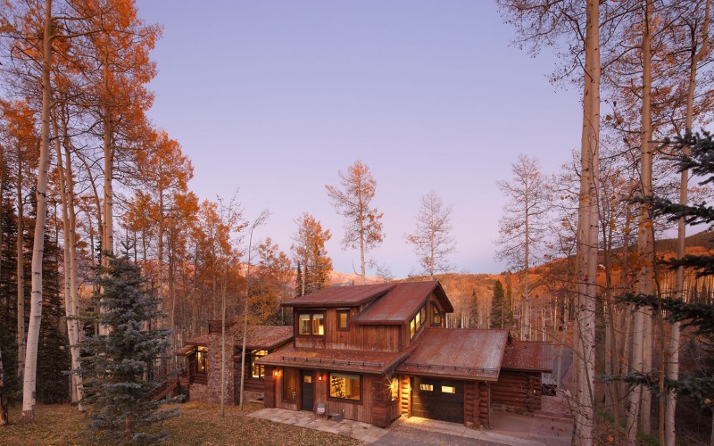 house in the woods in fall