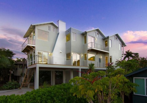 large stilt house with grey exterior