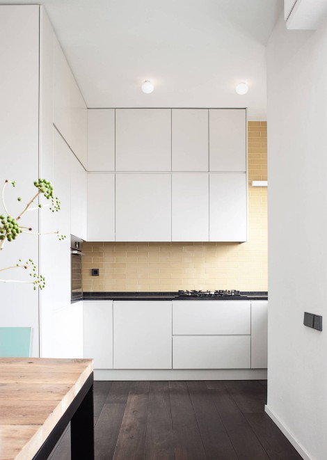 white kitchen with beige backsplash